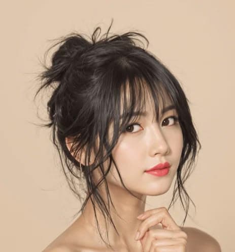 Messy Bun with Wispy Bangs — Korean women's hairstyle